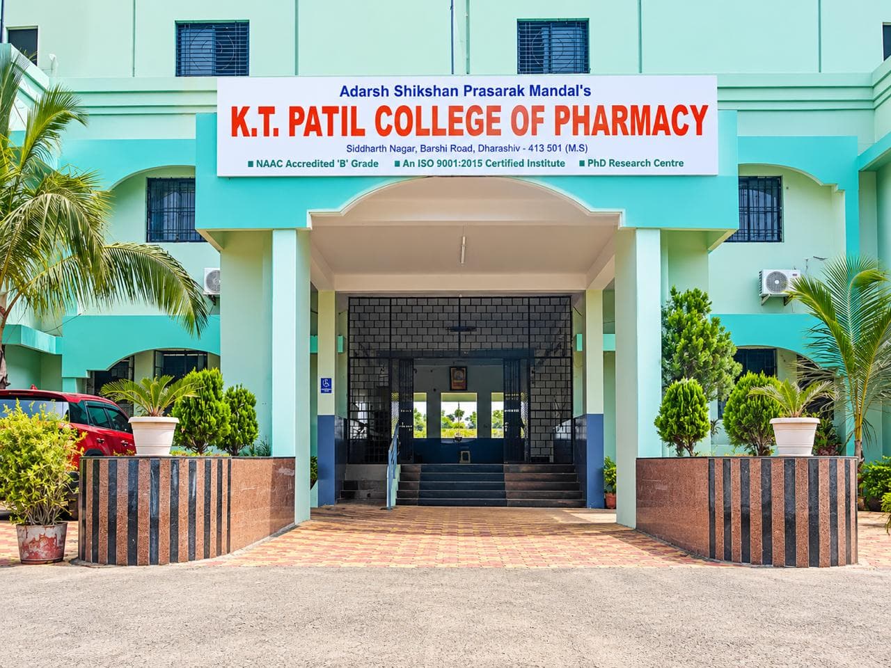ASPM's K.T. Patil College of Pharmacy campus building in Dharashiv, Maharashtra
